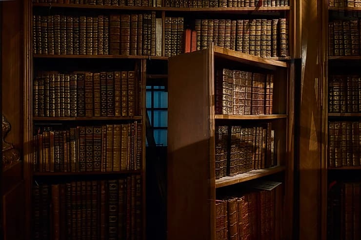 a door hidden in a bookshelf